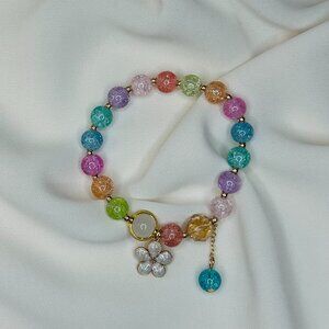 Multicolor beaded bracelet with a white flower charm!